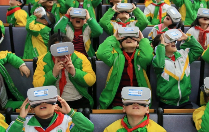 Primary school students in China wear virtual reality headsets